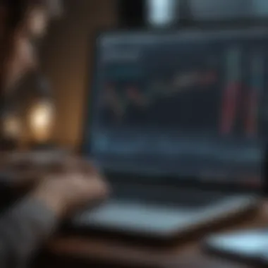 A person analyzing stock market data on a laptop